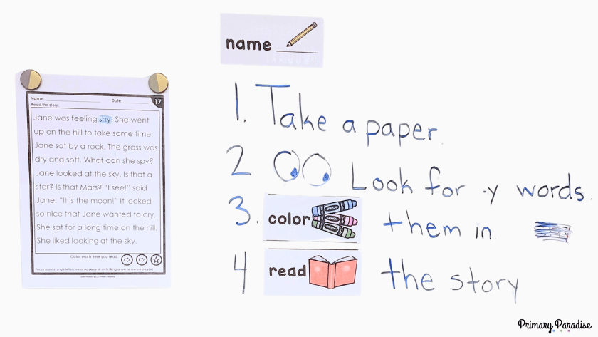 A fluency passage on the white board with student instructions to the right